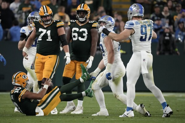 Detroit Lions defensive end John Cominsky (79) celebrates with teammate Aidan Hutchinson (97) after sacking Green Bay Packers quarterback Jordan Love (10) during the second half of an NFL football game, Thursday, Sept. 28, 2023, in Green Bay, Wis. (AP Photo/Morry Gash)