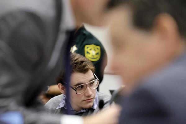 Marjory Stoneman Douglas High School shooter Nikolas Cruz is shown at the defense table during the penalty phase of Cruz's trial at the Broward County Courthouse in Fort Lauderdale, Fla., on Monday, Sept. 12, 2022. Cruz pleaded guilty to murdering 17 students and staff members in 2018 at Parkland's high school. The trial is only to determine if the 23-year-old is sentenced to death or life without parole. (Amy Beth Bennett/South Florida Sun-Sentinel via AP, Pool)