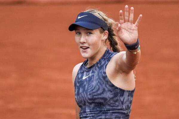 Russia's Mirra Andreeva celebrates winning her fourth round match of the French Open tennis tournament France's Varvara Gracheva at the Roland Garros stadium in Paris, Monday, June 3, 2024. (AP Photo/Christophe Ena)
