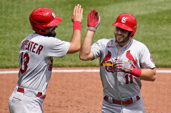 St. Louis Cardinals' Paul DeJong (11) celebrates with Matt Carpenter after hitting a two-run home run off Pittsburgh Pirates starting pitcher JT Brubaker during the fourth inning of a baseball game in Pittsburgh, Thursday, Aug. 12, 2021. (AP Photo/Gene J. Puskar)