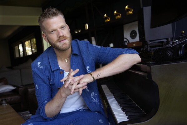 Singer-songwriter Scott Hoying poses for a portrait at his home, Friday, July 28, 2023, in Los Angeles. (AP Photo/Chris Pizzello)