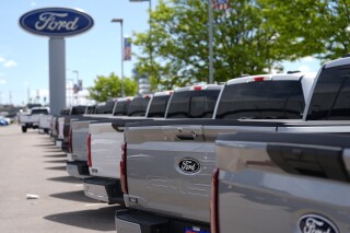 A line of unsold 2024 F150 pickup trucks sit at a Ford dealership Sunday, May 19, 2024, in Denver. The Conference Board reports on U.S. consumer confidence for May on Tuesday, May 28, 2024. (AP Photo/David Zalubowski)