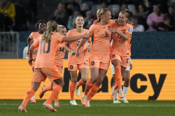 Netherlands' Stefanie Van der Gragt, second right, celebrates with teammates after scoring during the first half of the FIFA Women's World Cup Group E soccer match between the Netherlands and Portugal in Dunedin, New Zealand, Sunday, July 23, 2023. (AP Photo/Alessandra Tarantino)