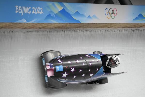 Elana Meyers Taylor, of the United States, drives her bobsled during a women's monobob training heat at the 2022 Winter Olympics, Thursday, Feb. 10, 2022, in the Yanqing district of Beijing. (AP Photo/Mark Schiefelbein)