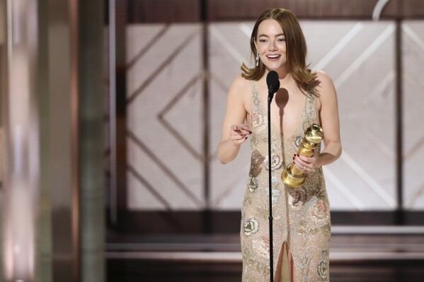 This image released by CBS shows Emma Stone accepting the award for best female actor in a motion picture for her role in "Poor Things" during the 81st Annual Golden Globe Awards in Beverly Hills, Calif., on Sunday, Jan. 7, 2024. (Sonja Flemming/CBS via AP)