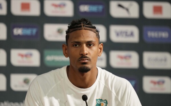 Ivory Coast's Sebastien Haller, listens to questions during a media conference, in Abidjan, Ivory Coast, Saturday, Feb. 10, 2024. Ivory Coast will play the African Cup of Nations soccer Final match against Nigeria on Sunday, Feb. 11, 2024. (APPhoto/Sunday Alamba)