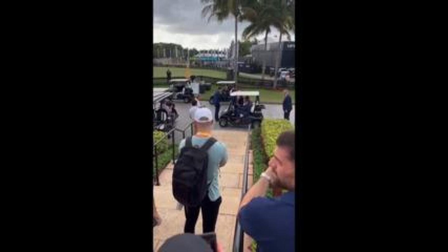 Eric Trump drives his dad on a golf cart in his Doral resort after a LIV golf event