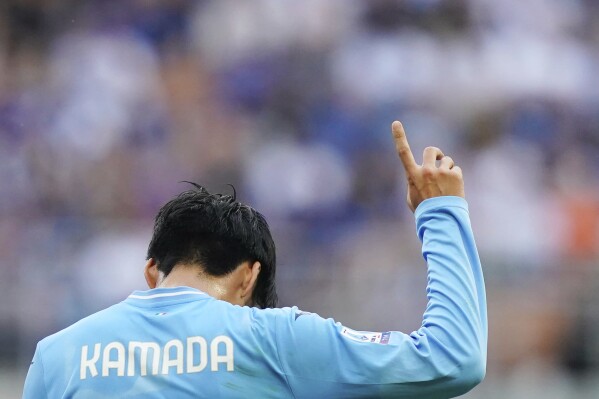 Lazio's Daichi Kamada celebrates after scoring his side's first goal during the Serie A soccer match between Inter and Lazio at the San Siro Stadium in Milan, Italy, Sunday, May 19, 2024. (Spada/LaPresse via AP)