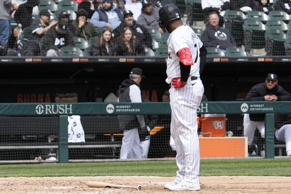 Chicago White Sox's Eloy Jimenez looks to the bench after being called out on strikes during the third inning of the team's baseball game against the Detroit Tigers in Chicago, Sunday, March 31, 2024. (AP Photo/Nam Y. Huh)