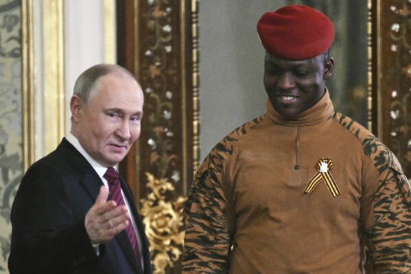 Russian President Vladimir Putin, left, welcomes Burkina Faso President Ibrahim Traore for the talks in the Grand Palace at the Kremlin in Moscow, Russia, on May 10, 2025. (Angelos Tzortzinis/Pool Photo via AP, file)