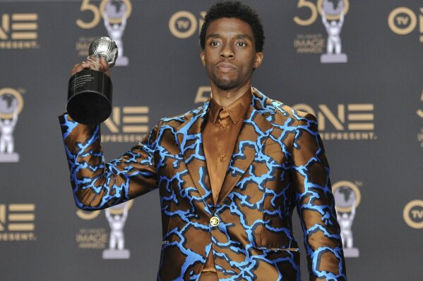 FILE - In this Saturday, March 30, 2019 file photo, Chadwick Boseman poses in the press room with the award for outstanding actor in a motion picture for "Black Panther" at the 50th annual NAACP Image Awards at the Dolby Theatre in Los Angeles. Actor Chadwick Boseman, who played Black icons Jackie Robinson and James Brown before finding fame as the regal Black Panther in the Marvel cinematic universe, has died of cancer. His representative says Boseman died Friday, Aug. 28, 2020 in Los Angeles after a four-year battle with colon cancer. He was 43. (Photo by Richard Shotwell/Invision/AP, File)