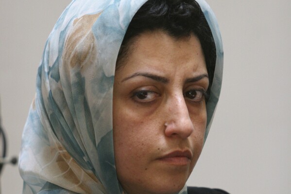 FILE - Prominent Iranian human rights activist Narges Mohammadi attends a meeting on women's rights in Tehran, Iran, on Aug. 27, 2007. Iran's imprisoned Nobel Peace Prize laureate Narges Mohammadi has been sentenced to another year in prison over her activism, her lawyer said Wednesday. (AP Photo/Vahid Salemi, File)