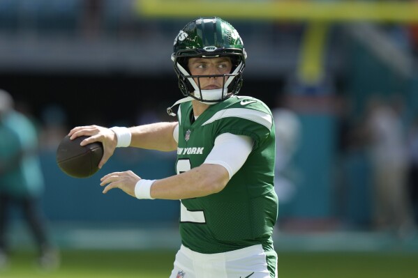 New York Jets quarterback Zach Wilson (2) warms up before an NFL football game against the Miami Dolphins, Dec. 17, 2023, in Miami Gardens, Fla. (AP Photo/Lynne Sladky, File)