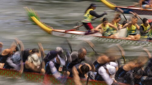 Competitors take part in the annual dragon boat race to celebrate the Tuen Ng festival in Hong Kong, Thursday, June 22, 2023. (AP Photo/Louise Delmotte)