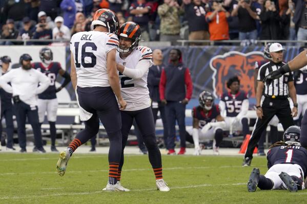 Chicago Bears kicker Cairo Santos (2) celebrates with Trenton Gill (16) after kicking a game-winning field goal against the Houston Texans during the second half of an NFL football game Sunday, Sept. 25, 2022, in Chicago. (AP Photo/Nam Y. Huh)