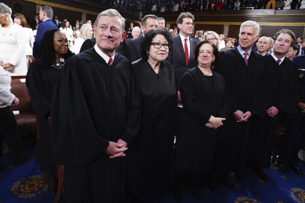 Chief Justice John Roberts, from front row left, Justice Sonia Sotomayor, Justice Elena Kagan, Justice Neil Gorsuch, Justice Brett Kavanaugh, and in back row left, Justice Ketanji Brown Jackson, arrive before President Joe Biden delivers the State of the Union address to a joint session of Congress at the Capitol, Thursday, March 7, 2024, in Washington. (Shawn Thew/Pool via AP)