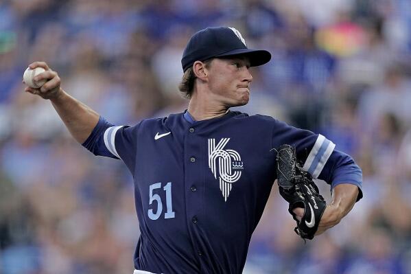 Kansas City Royals starting pitcher Brady Singer throws during the