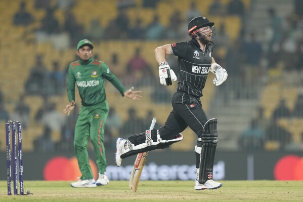 New Zealand's captain Kane Williamson run between the wickets during the ICC Men's Cricket World Cup match between New Zealand and Bangladesh in Chennai , India, Friday, Oct. 13, 2023. (AP Photo/Eranga Jayawardena)