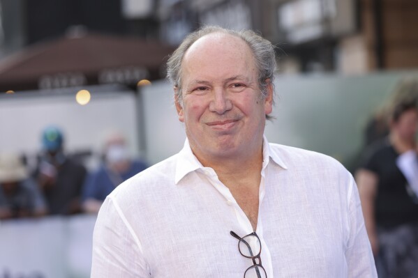 FILE - Hans Zimmer poses for photographers upon arrival for the screening of the film 'Thirteen Lives' in London, Monday, July 18, 2022. Hans Zimmer, the two-time Academy Award-winning composer, proposed to his partner on stage in London, prompting raucous applause from the audience. As his performance at the O2 arena was drawing to a close on the evening of Thursday, June 15, 2023, the 65-year-old German asked his partner to join him on stage — and then proceeded to declare his love. (Photo by Vianney Le Caer/Invision/AP, File)