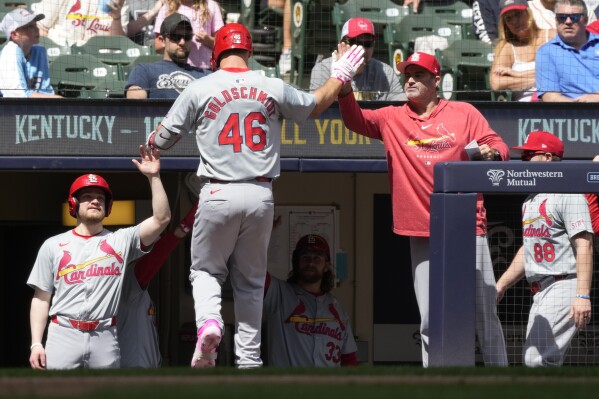 St. Louis Cardinals' Paul Goldschmidt is congratulated after hitting a home run during the fifth inning of a baseball game against the Milwaukee Brewers Sunday, May 12, 2024, in Milwaukee. (AP Photo/Morry Gash)