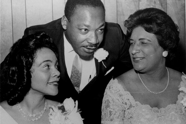 FILE- In this Aug. 9, 1965, file photo, Dr. Martin Luther King, Jr., president of the Southern Christian Leadership Conference, chats with his wife, Coretta, left, and civil rights champion Constance Baker Motley before the start of an S.C.L.C. banquet in Birmingham, Ala. The NAACP's Legal Defense Fund launched a $40 million scholarship program on Monday, Jan. 18, 2021, to create a new generation of civil rights lawyers. The Marshall-Motley Scholars Program, named for the legal defense fund's founder and Supreme Court Justice Thurgood Marshall, and his staff attorney Constance Baker Motley, who later became the first Black female federal judge. (AP Photo/File)