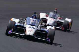 Takuma Sato, of Japan, leads Marco Andretti into turn one during the Indianapolis 500 auto race at Indianapolis Motor Speedway, Sunday, Aug. 23, 2020, in Indianapolis. (AP Photo/Darron Cummings)