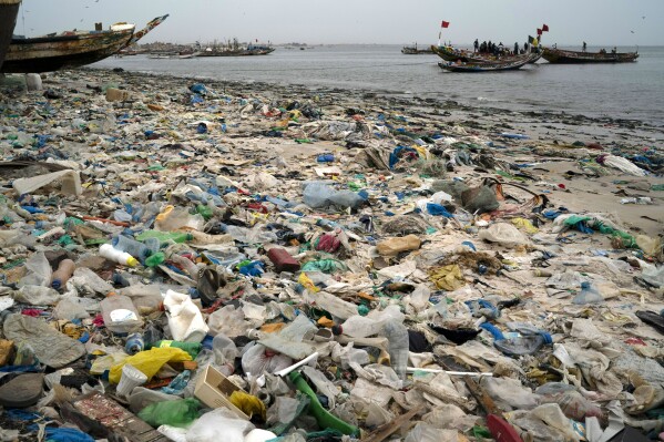 FILE - Trash and plastics litter the sand of Yarakh Beach in Dakar, Senegal, Nov. 8, 2022. Negotiators at UN-led talks in Nairobi have failed to agree on how to advance work towards the development of a global treaty to end plastic pollution. Environmental advocates say some oil-producing governments used stalling tactics designed to ultimately weaken the treaty.(AP Photo/Leo Correa, File)