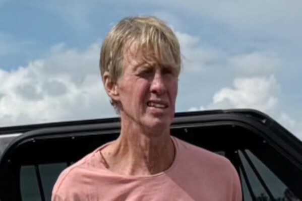 In this imaged released by the Martin County, Fla., Sheriff's Office, law enforcement officers arrest Ryan Routh, the man suspected in the apparent assassination attempt of Donald Trump, Sept. 15, 2024. (Martin County Sheriff's Office via AP, file)