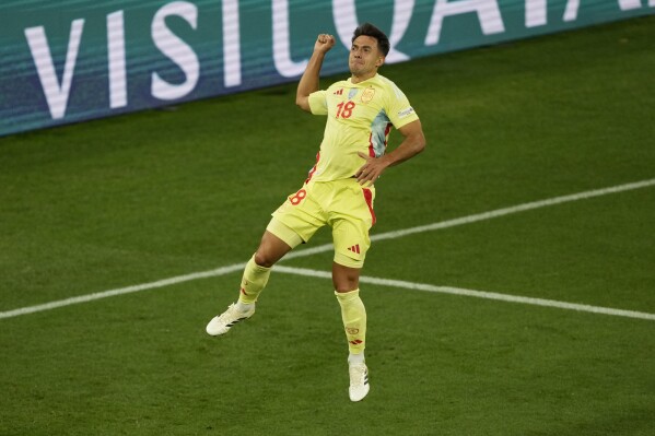 Spain's Martin Zubimendi celebrates after scoring the opening goal against Portugal during the Nations League final soccer match between Portugal and Spain at the Allianz Arena in Munich, Germany, Sunday, June 8, 2025. (AP Photo/Michael Probst)