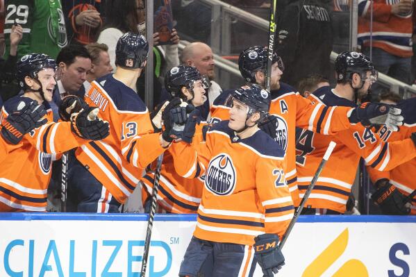 Edmonton Oilers' Tyson Barrie (22) celebrates a goal against the Buffalo Sabres during third-period NHL hockey game action in Edmonton, Alberta, Thursday, March 17, 2022. (Jason Franson/The Canadian Press via AP)