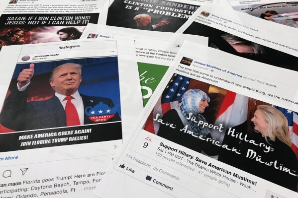 FILE - Printouts of some of the Facebook and Instagram ads linked to a Russian effort to disrupt the American political process and stir up tensions around divisive social issues, released by members of the U.S. House Intelligence committee, photographed in Washington, are photographed on Nov. 1, 2017. Federal prosecutors and lawyers for Donald Trump have signaled their desire to invoke the 2016 election in the former president's trial on charges of scheming to overturn the results of the 2020 presidential election.(AP Photo/Jon Elswick, File)