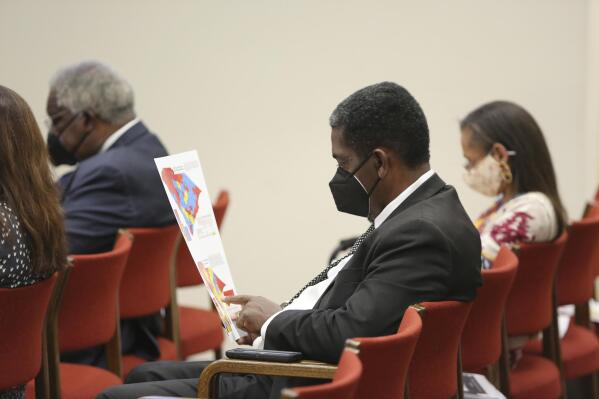 South Carolina Rep. Jerry Govan, D-Orangeburg, looks over a map during a House redistricting committee public hearing on Nov. 10, 2021, in Columbia, S.C. Federal judges are deciding whether South Carolina's new congressional maps are legal in a lawsuit by the NAACP which says the districts dilute Black voting power. (AP Photo/Jeffrey Collins)