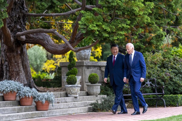 President Joe Biden and China's President President Xi Jinping walk in the gardens at the Filoli Estate in Woodside, Calif., Wednesday, Nov, 15, 2023, on the sidelines of the Asia-Pacific Economic Cooperative conference. (Doug Mills/The New York Times via AP, Pool)