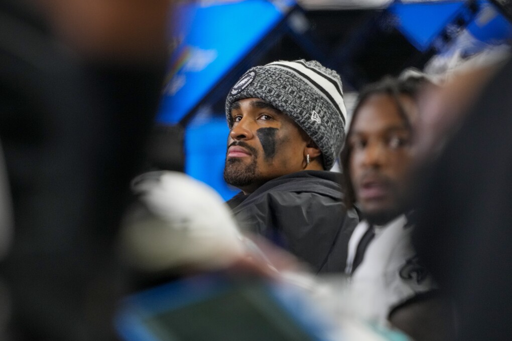 Philadelphia Eagles quarterback Jalen Hurts looks on from the bench during the first half of an NFL football game against the Seattle Seahawks, Monday, Dec. 18, 2023, in Seattle. (AP Photo/Lindsey Wasson)