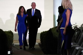 Vice President Mike Pence and second lady Karen Pence arrive to listen to first lady Melania Trump to speak during the 2020 Republican National Convention from the Rose Garden of the White House, Tuesday, Aug. 25, 2020, in Washington. (AP Photo/Evan Vucci)