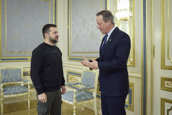 In this photo provided by the Ukrainian Presidential Press Office on Wednesday, Nov. 15, 2023, Ukrainian President Volodymyr Zelenskyy, left, speaks with Britain's Foreign Secretary David Cameron on the occasion of their meeting, in Kyiv, Ukraine. (Ukrainian Presidential Press Office via AP)