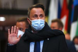 FILE - In this Friday, June 25, 2021 file photo, Luxembourg's Prime Minister Xavier Bettel leaves at the end of the first day of an EU summit in Brussels. Luxembourg Prime Minister Xavier Bettel was in observation in hospital early Monday, July 5, 2021 "as a precautionary measure" after he had tested positive for COVID-19 a week earlier. (Aris Oikonomou, Pool Photo via AP, File)