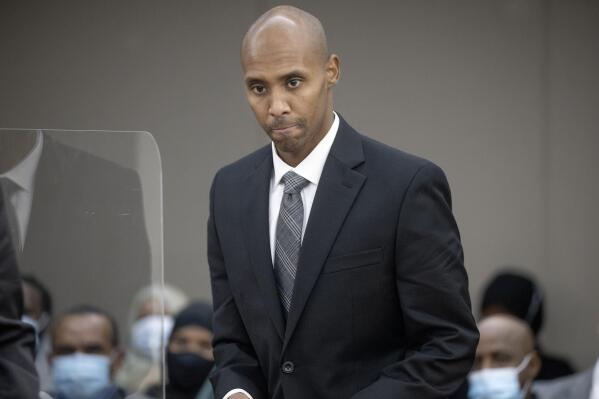 Former officer Mohamed Noor makes his way to the podium to address Judge Kathryn Quaintance at the Hennepin County Government Center, Thursday, Oct. 21, 2021 in Minneapolis. The Minneapolis police officer who fatally shot an unarmed woman after she called 911 to report a possible rape happening behind her home was sentenced Thursday to nearly five years in prison — the most the judge could impose but less than half the 12½ years he was sentenced to for his murder conviction that was overturned last month. (Elizabeth Flores/Star Tribune via AP, Pool)