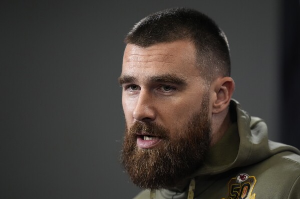Kansas City Chiefs tight end Travis Kelce talks to the media before the team's NFL football practice Friday, Feb. 2, 2024 in Kansas City, Mo. The Chiefs will play the San Francisco 49ers in Super Bowl 58. (AP Photo/Charlie Riedel)