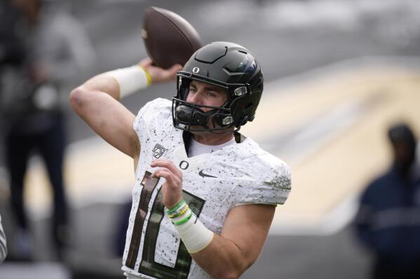 Oregon quarterback Bo Nix warms up before an NCAA college football game against Colorado, Saturday, Nov. 5, 2022, in Boulder, Colo. (AP Photo/David Zalubowski)