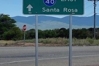 This photo provided by the New Mexico Department of Transportation shows a misspelled sign in New Mexico. A newly upgraded state Department of Transportation sign erected last week that pointed drivers toward Albuquerque misspelled the city's name, losing the “R.” (New Mexico Department of Transportation via AP)