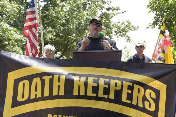 FILE - Stewart Rhodes, founder of the Oath Keepers, center, speaks during a rally outside the White House in Washington, June 25, 2017.  Federal prosecutors are preparing to lay out their case against the founder of the Oath Keepers’ extremist group and four associates. They are charged in the most serious case to reach trial yet in the Jan. 6, 2021, U.S. Capitol attack. Opening statements are expected Monday in Washington’s federal court in the trial of Stewart Rhodes and others charged with seditious conspiracy. (AP Photo/Susan Walsh, File)