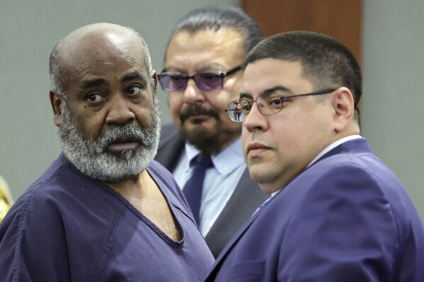 FILE - Duane "Keffe D" Davis, left, with deputy special public defenders Robert Arroyo, right, and Charles Cano, rear, appears for his arraignment at the Regional Justice Center, Nov. 2, 2023, in Las Vegas. The former Los Angeles-area gang leader accused of murder in the killing of hip-hop music icon Tupac Shakur in 1996 in Las Vegas is seeking to be released to house arrest ahead of his murder trial in June 2024. A Nevada judge on Tuesday, Dec. 19, 2023, set a Tuesday, Jan. 2, 2024, hearing on the request by Davis. (Ethan Miller/Pool Photo via AP, File)