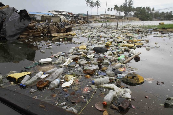 FILE - Plastic fills waters in Port Bouet outside Abidjan, Ivory Coast, June 2, 2023. (AP Photo/Diomande Ble Blonde, File)