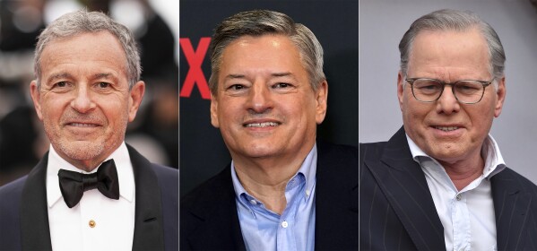 This combination of photos shows Disney CEO Bob Iger, left, Netflix co-CEO Ted Sarandos and Warner Bros. Discovery CEO David Zaslav. Negotiations between striking screenwriters and Hollywood studios are set to resume Wednesday, the latest attempt to bring an end to pickets that have brought film and television productions to a halt. The two sides have been divided on issues of pay, the size of writing staffs on shows and the use of artificial intelligence in how scripts are created. (AP Photo)