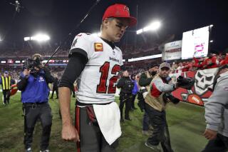 Quarterback (12) Tom Brady of the Tampa Bay Buccaneers walks off the field  after a Buccaneer to …