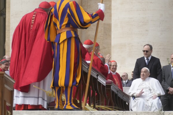 Pope Francis arrives at the end of Palm Sunday Mass at St. Peter's Square in Vatican City, April 13, 2025. (AP Photo/Gregorio Borgia)