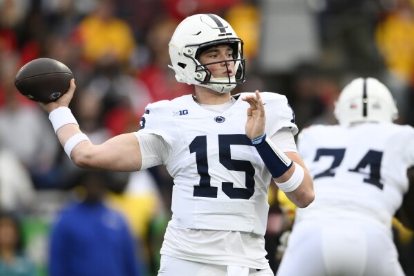 Penn State quarterback Drew Allar (15) looks to pass the ball during the first half of an NCAA college football game against Maryland, Saturday, Nov. 4, 2023, in College Park, Md. (AP Photo/Nick Wass)