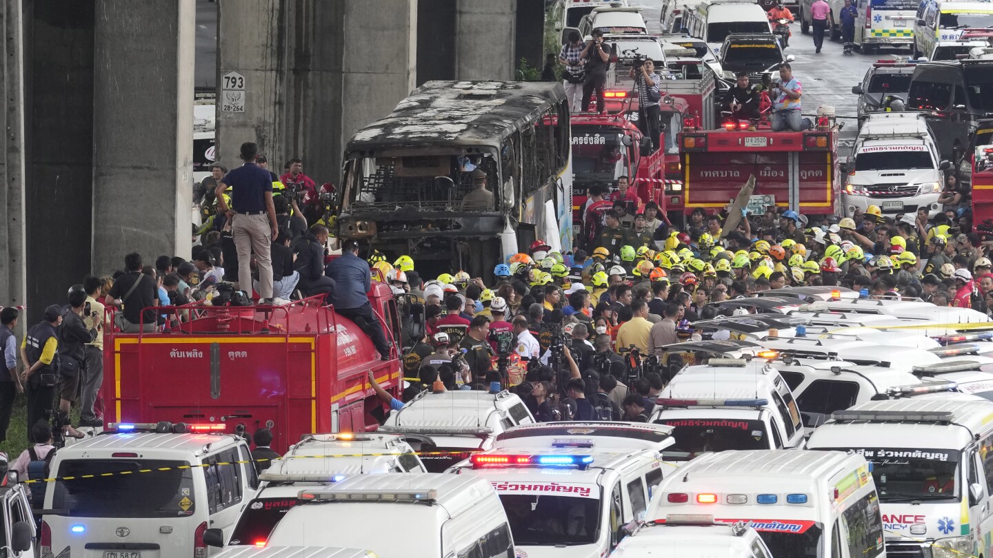 Thai police arrest driver and work to identify victims of school bus fire that killed 23
