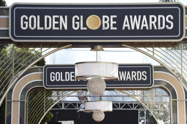 FILE - Event signage appears above the red carpet at the 77th annual Golden Globe Awards on Jan. 5, 2020, in Beverly Hills, Calif. The 80th annual Golden Globe Awards will take place on Tuesday, Jan. 10. (Photo by Jordan Strauss/Invision/AP, File)